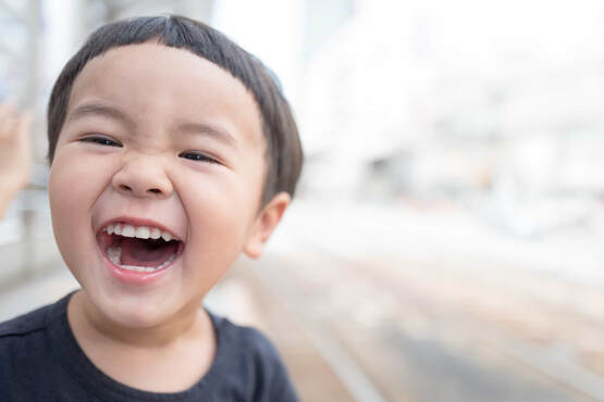 Chinese Kid with a huge smile